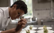 Chef puts the last finishes on her dishes.