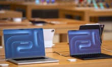 Two MacBook Pro laptops in the Apple store on Kurfürstendamm