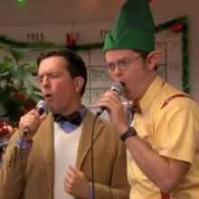 Dwight and Andy singing karaoke together at an office Christmas party.