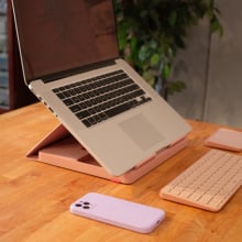 laptop set up on pink logitech casa pop-up desk