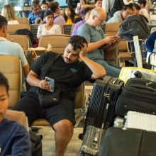 Passengers seated at Suvarnabhumi Airport in Bangkok, Thailand on July 19.