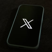 X logo on mobile device