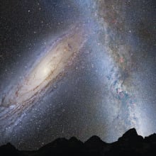 A hypothetical view from Earth as the Andromeda galaxy (on left) is about to collide with part of the Milky Way galaxy. 