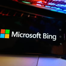 The Microsoft Bing logo on a dark phone screen.