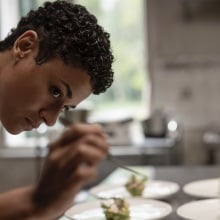 Chef puts the last finishes on her dishes.