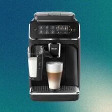 Philips coffee machine on green background