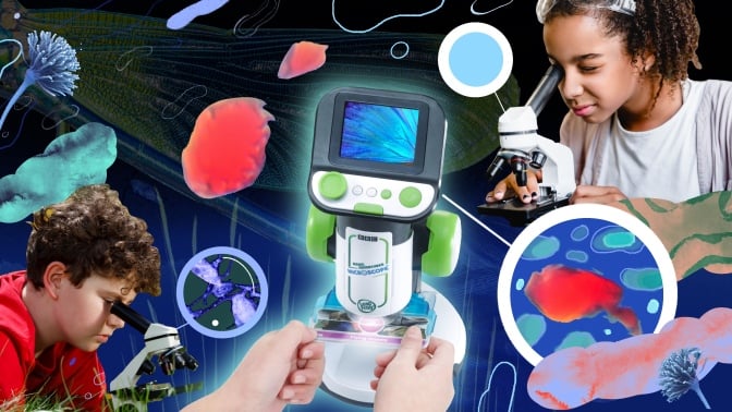 child playing with plastic microscope with screen