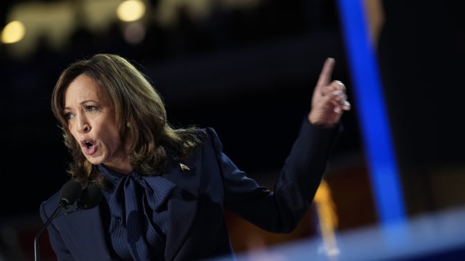 Kamala Harris speaking enthusiastically at the DNC podium.