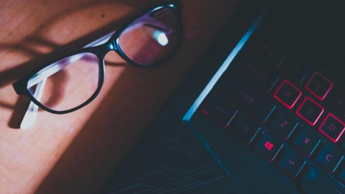 Glasses and keyboard