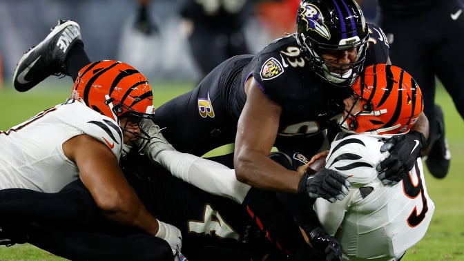 oe Burrow of the Cincinnati Bengals is sacked by the Ravens