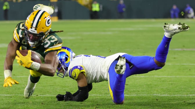 Aaron Jones of the Green Bay Packers avoids a tackle 