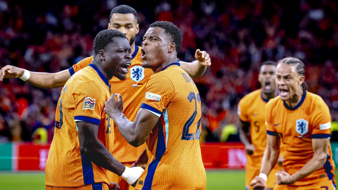 Netherlands forward Brian Brobbey and Netherlands defender Denzel Dumfries celebrate