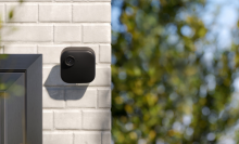 Blink outdoor security camera on wall outside home