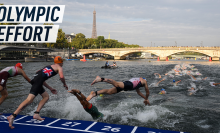 Atheletes jump in the river Seine, with Pont Neuf and the Eiffel Tower in the background. Caption reads "Olympic effort"