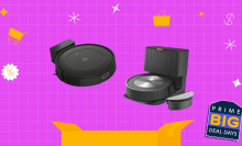 Various Roomba robot vacuums in front of a purple background