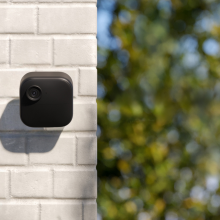 Blink outdoor security camera on wall outside home