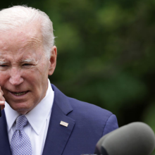 U.S. President Joe Biden talks on a cell phone during a Rose Garden event at the White House to mark National Small Business Week on May 1, 2023 in Washington, DC.