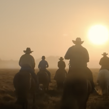 A herd of drovers ride into the sunset in a film still from "Territory".