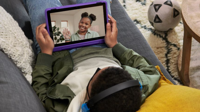 Children video calling on purple tablet