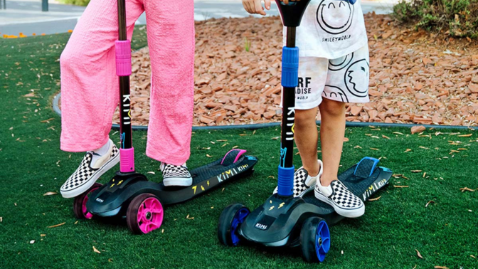 close up of kids playing on Kimi scooters